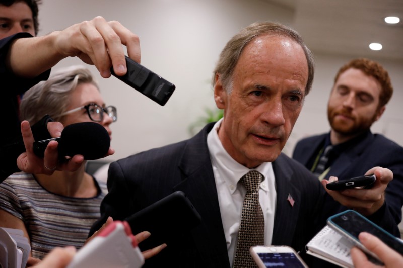 © Reuters. Senator Tom Carper speaks to reporters ahead of the weekly party luncheons on Capitol Hill in Washington