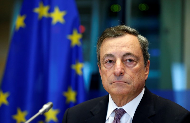 © Reuters. ECB President Draghi arrives to address the EU Parliament's Economic and Monetary Affairs Committee in Brussels