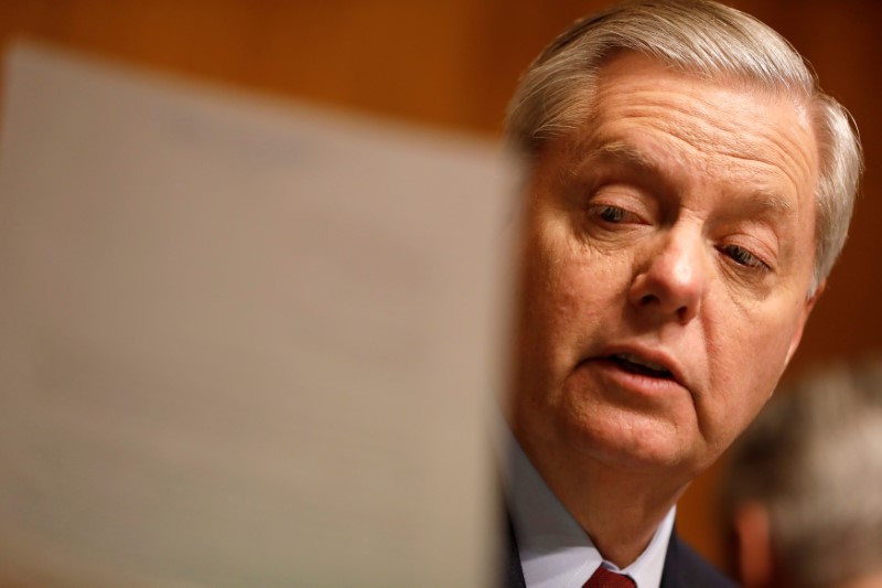 © Reuters. File photo: Chairman Sen. Lindsay Graham reads a letter from the FBI at a Senate Judiciary Subcommittee on Crime and Terrorism hearing about Russian election interference on Capitol Hill