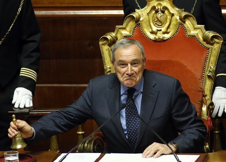 © Reuters. Former anti-mafia judge Grasso uses the bell after the vote electing him as the new Senate president at the Senate in Rome