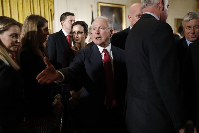 © Reuters. U.S. Attorney General Sessions greets guests in the East Room of the White House after opioids announcement in Washington