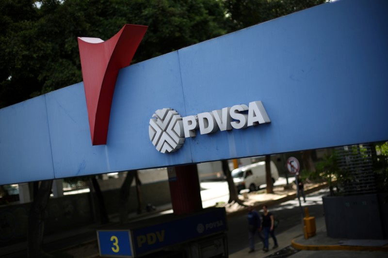 © Reuters. FILE PHOTO: The corporate logo of the state oil company PDVSA is seen at a gas station in Caracas