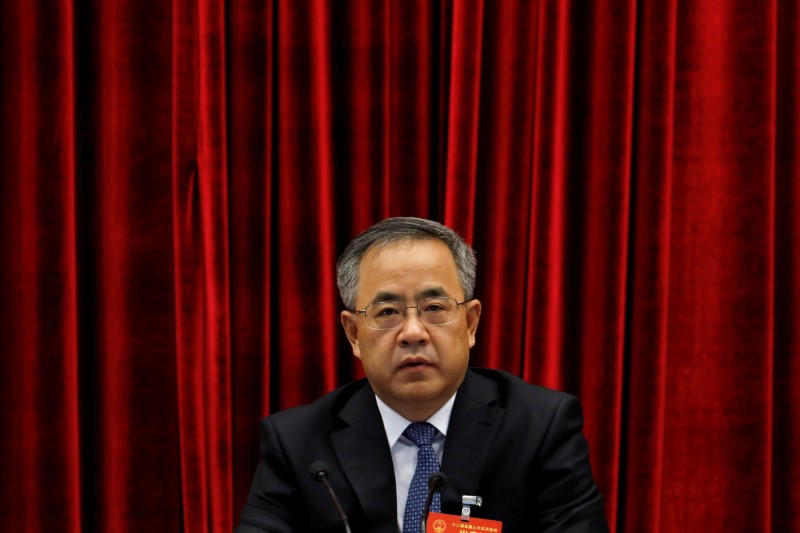 © Reuters. FILE PHOTO - Guangdong provincial party boss Hu Chunhua attends the Guangdong delegation's group discussion during the National People's Congress (NPC), at Capital Hotel in Beijing, China