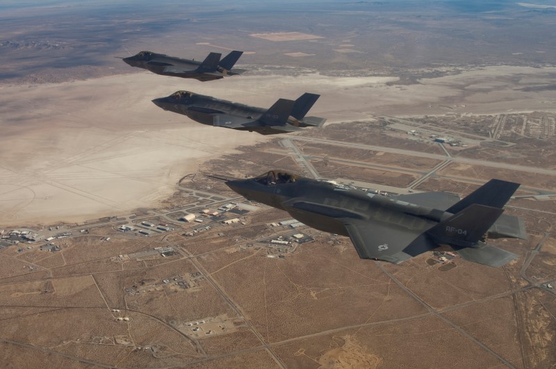 © Reuters. FILE PHOTO: Three F-35 Joint Strike Fighters flies over Edwards Air Force Base