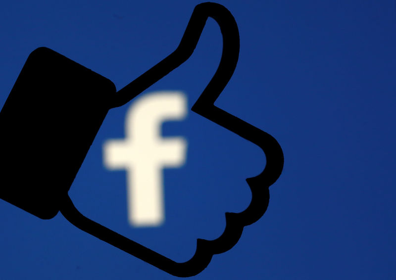 © Reuters. A 3D-printed Facebook like button is seen in front of the Facebook logo, in this illustration