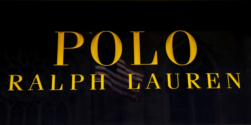 © Reuters. The U.S. flag is reflected over the door at the Ralph Lauren Corp.'s flagship Polo store on Fifth Avenue in New York
