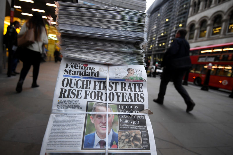 © Reuters. Newspaper headlines herald the Bank of England's decision to raise in interest in central London