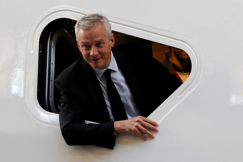© Reuters. FILE PHOTO: French Finance Minister Bruno Le Maire looks from a window of the cockpit of a high-speed train TGV at the Alstom factory in Belfort