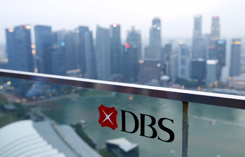 © Reuters. A DBS logo in pictured in the backdrop of the central business district in Singapore