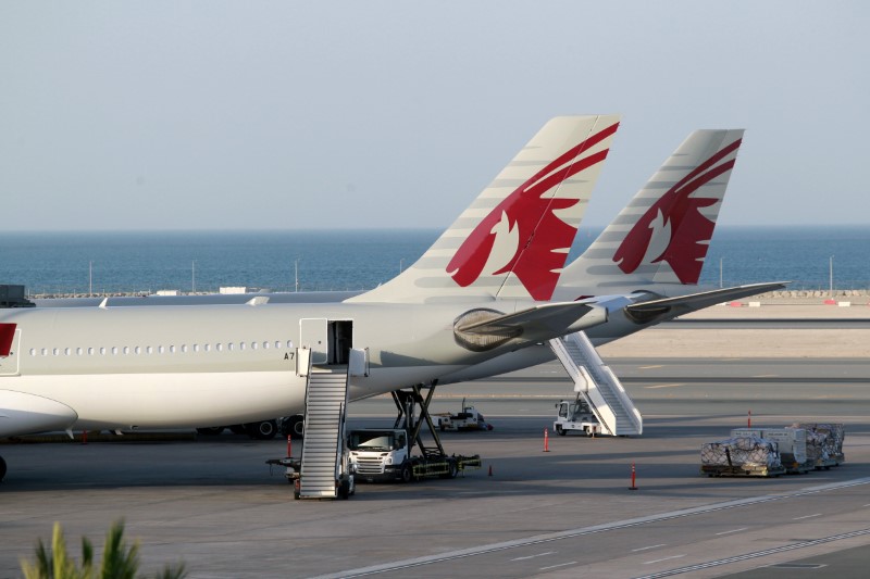 © Reuters. Qatar Airways aircrafts are seen at Hamad International Airport in Doha