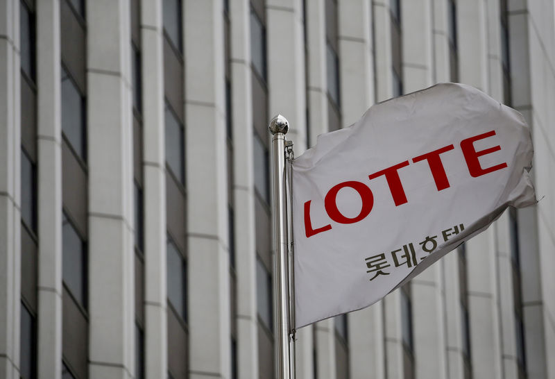 © Reuters. FILE PHOTO: A flag bearing the logo of Lotte Hotel flutters at a Lotte Hotel in Seoul