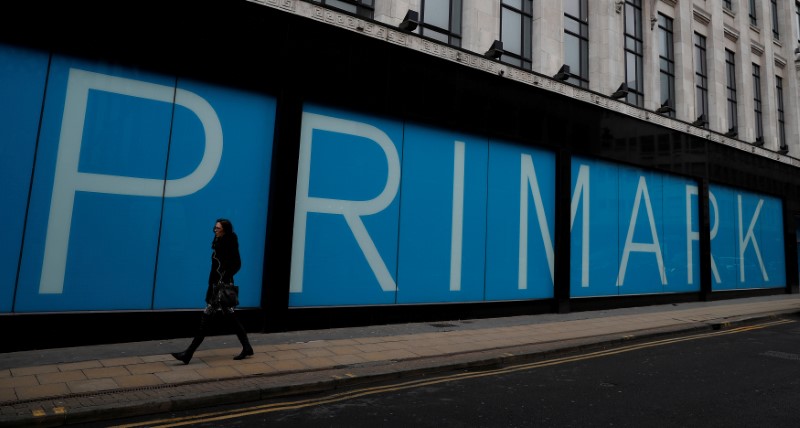 © Reuters. FILE PHOTO: A woman walks past a branch of Primark in Manchester