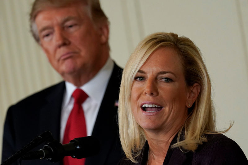 © Reuters. U.S. President Donald Trump listens to his  Secretary of Homeland Security nominee Kirstjen Nielsen