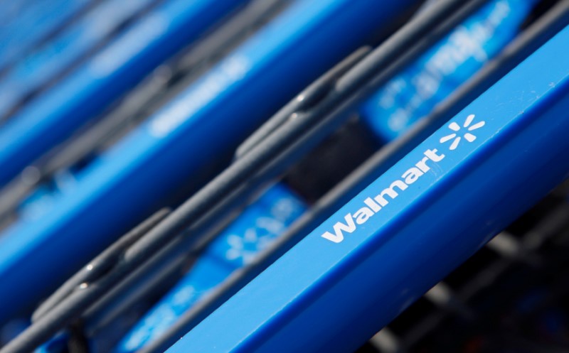 © Reuters. Shopping carts are seen outside a new Wal-Mart Express store in Chicago