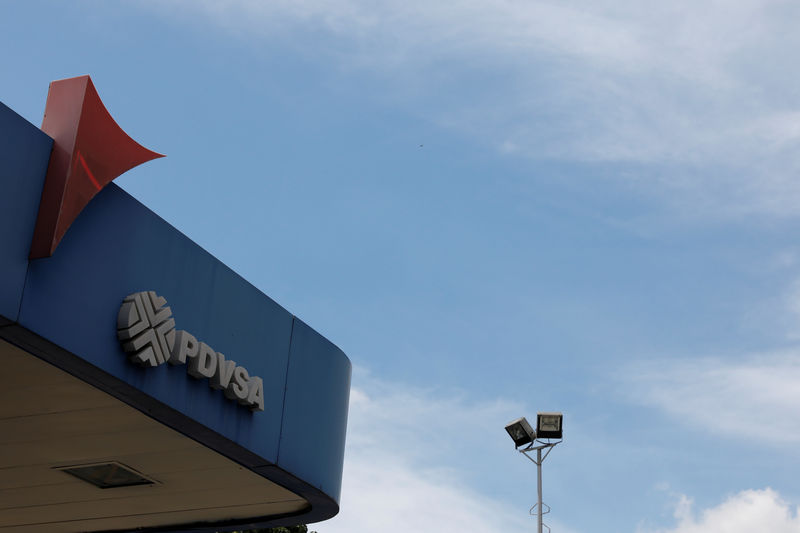 © Reuters. FILE PHOTO: The corporate logo of the state oil company PDVSA is seen at a gas station in Caracas