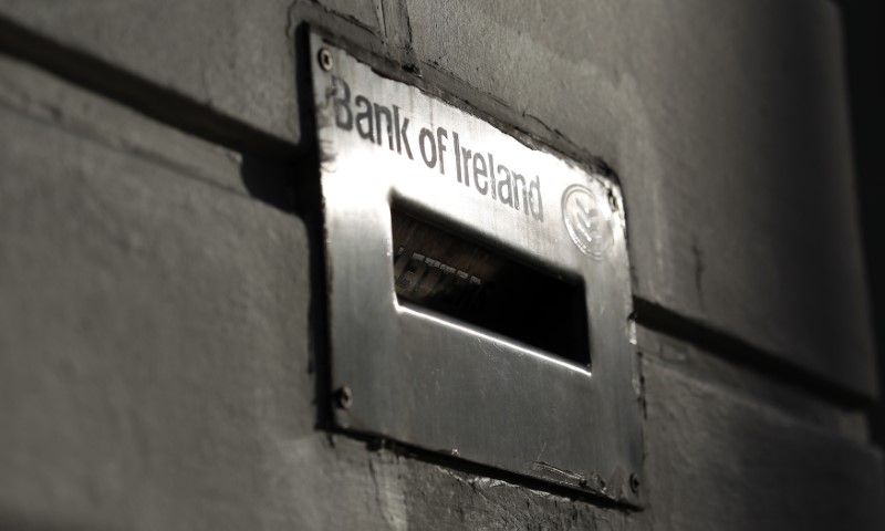 © Reuters. Sunlight is reflected off a deposit box on the exterior of a Bank Of Ireland branch in Belfast