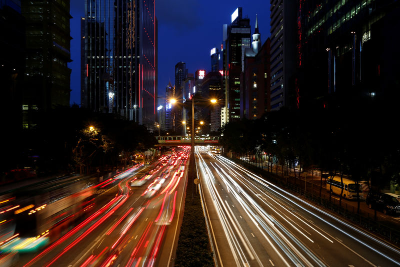 © Reuters. Traffic is seen between office buildings in downtown Hong Kong
