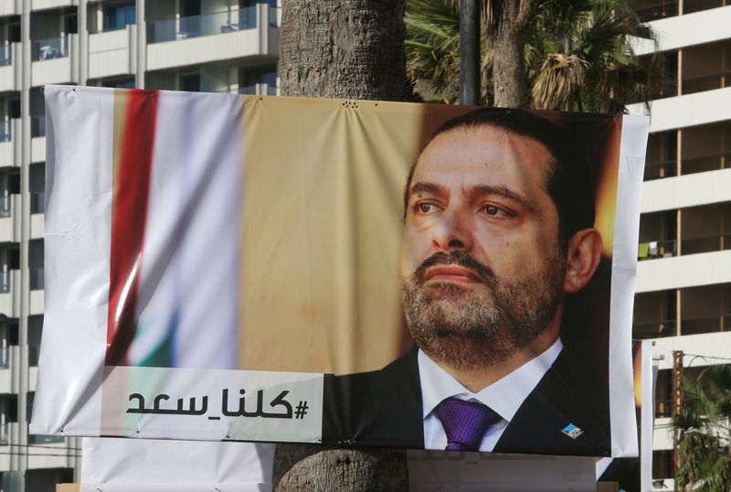 © Reuters. A poster depicting Lebanon's Prime Minister Saad al-Hariri, who has resigned from his post, is seen in Beirut