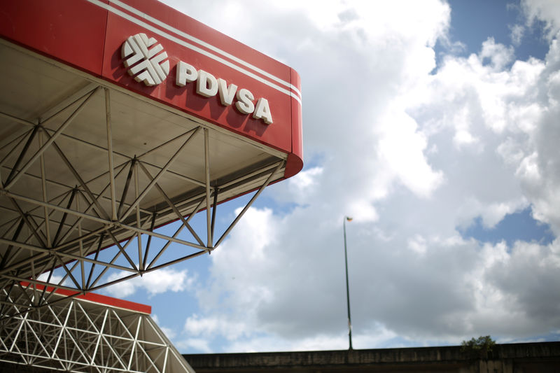 © Reuters. FILE PHOTO: The corporate logo of the state oil company PDVSA is seen at a gas station in Caracas