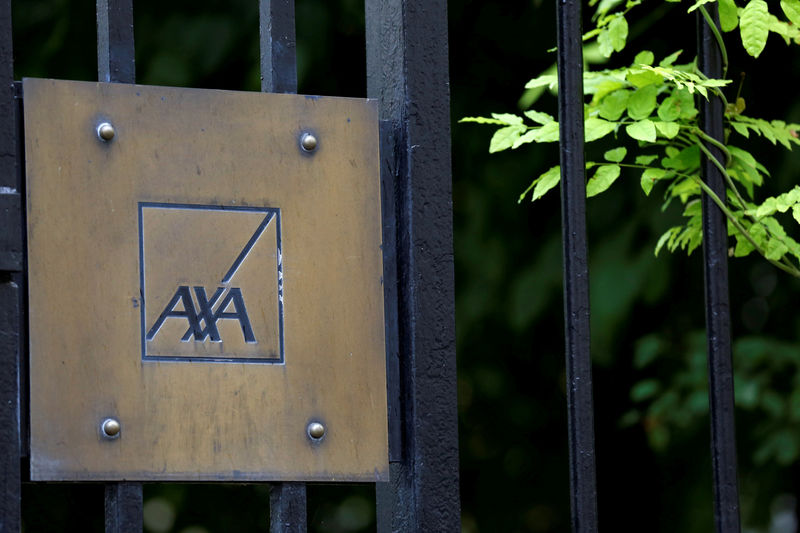 © Reuters. FILE PHOTO: Logo of France's biggest insurer Axa is seen in front the compagny headquarter in Paris