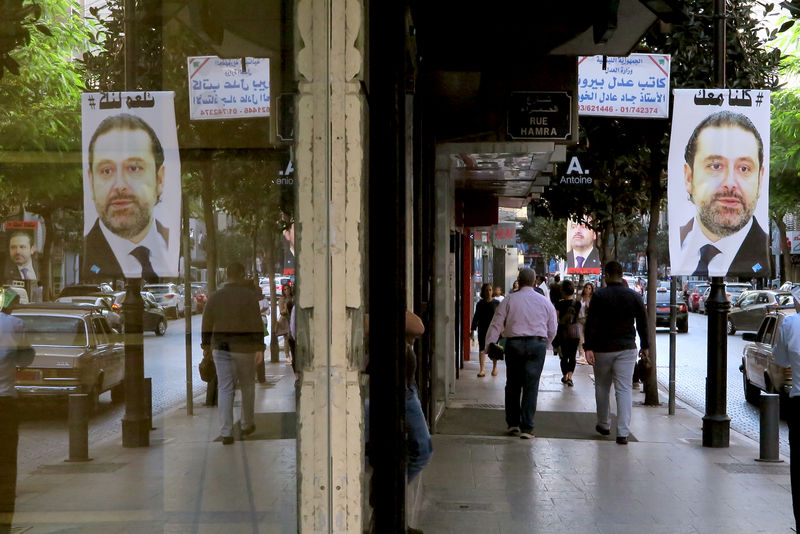 © Reuters. A poster showing Lebanese Prime Minister Saad al-Hariri, who announced his resignation from Saudi Arabia, is seen in Beirut
