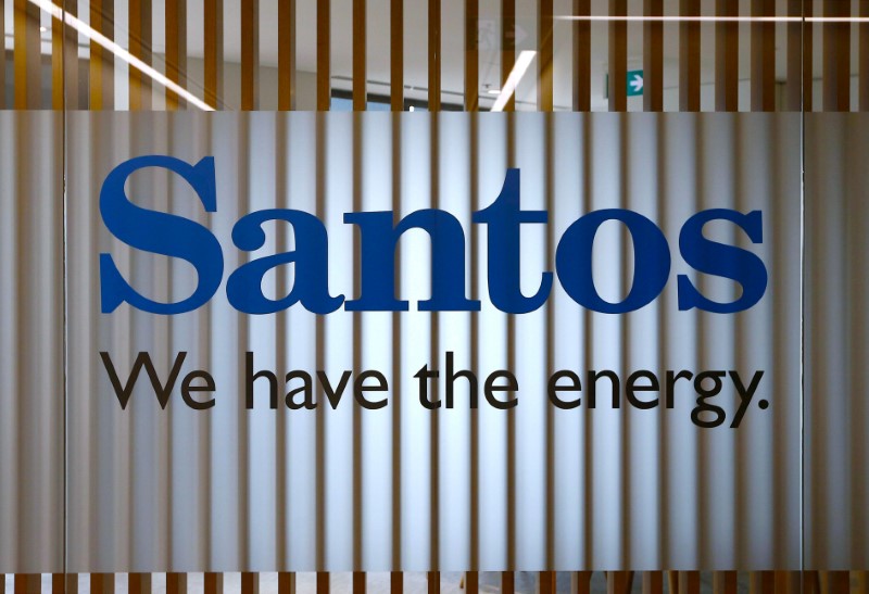 © Reuters. FILE PHOTO - The logo of Australian oil and gas producer Santos Ltd is pictured at their Sydney office