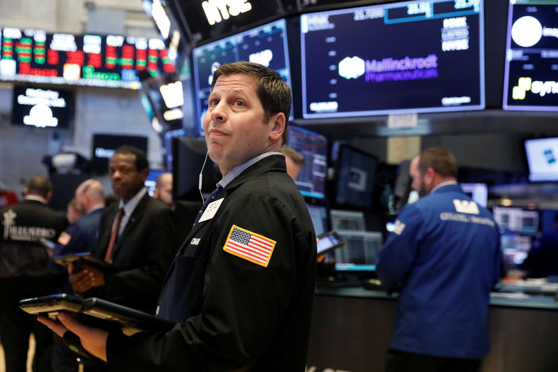 © Reuters. Traders work on the floor of the New York Stock Exchange shortly after the opening bell in New York