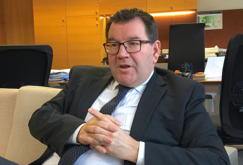 © Reuters. New Zealand's Finance Minister Grant Robertson reacts during an interview in his office in Wellington