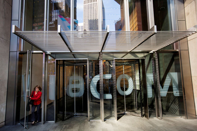 © Reuters. FILE PHOTO: A woman exits the Viacom Inc. headquarters in New York