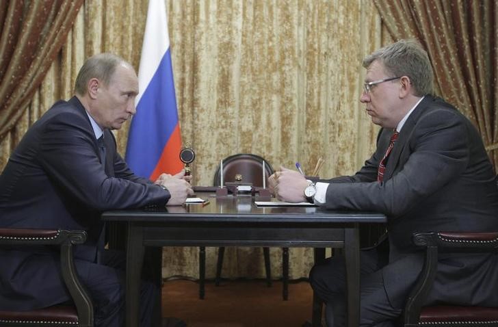 © Reuters. Владимир Путин и Алексей Кудрин, 28 февраля 2011 года