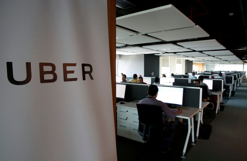 © Reuters. FILE PHOTO: Employees work inside Uber COE in Cairo