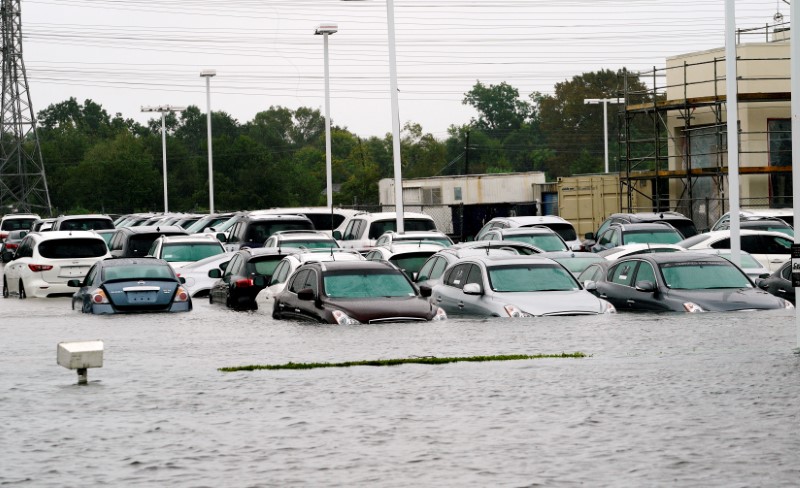 © Reuters. FILE PHOTO: A car dealership is covered by Hurricane Harvey floodwaters near Houston