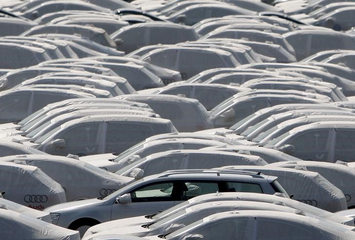 © Reuters. New VW cars covered with protective covers on a transport ship at Emden harbour