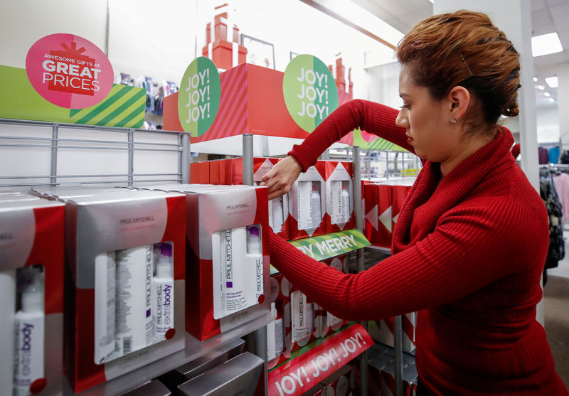 © Reuters. FILE PHOTO: An employee works on a display at the J.C. Penney department store in North Riverside