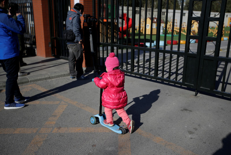 © Reuters. Child plays outside the kindergarten run by pre-school operator RYB Education Inc