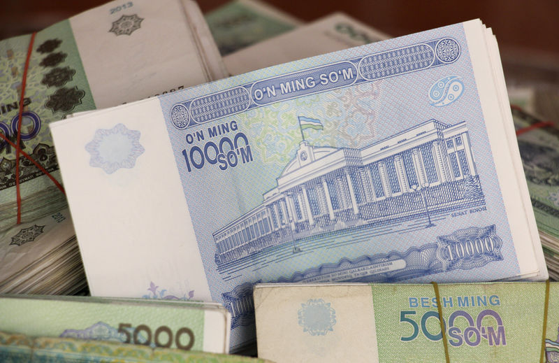 © Reuters. Uzbekistani Som banknotes are seen in this picture illustration