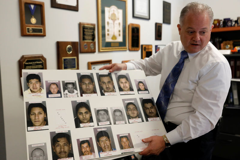 © Reuters. Fred Harran, Director of Public Safety for the Bensalem Police Department, shows an illustration at police headquarters in Bensalem