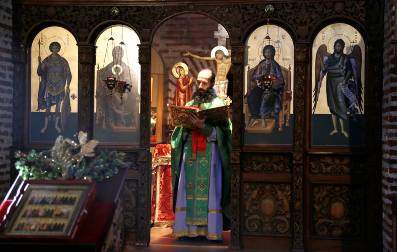 © Reuters. FILE PHOTO: An Orthodox priest recites mass at the Church of St. George in Sofia