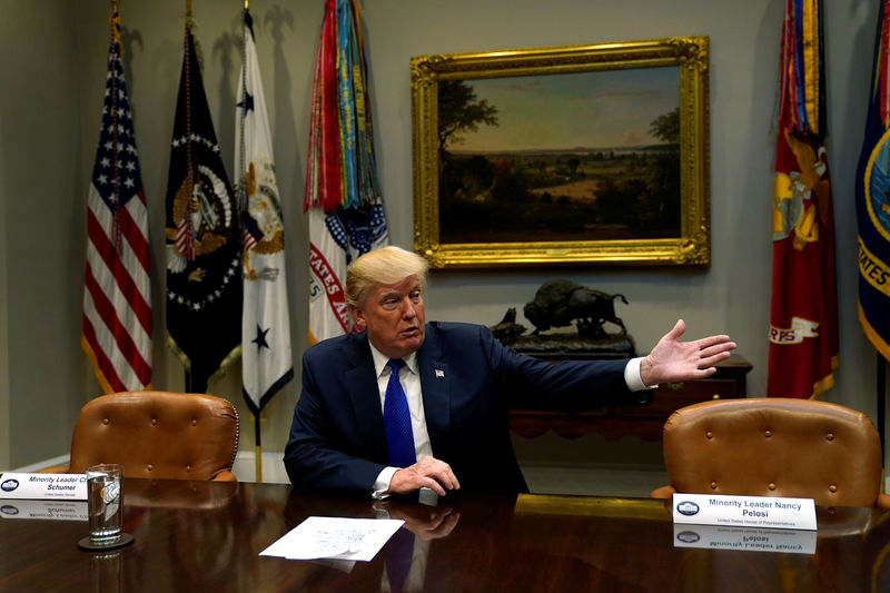 © Reuters. Trump speaks with reporters after meeting with McConnell and Ryan at the White House in Washington