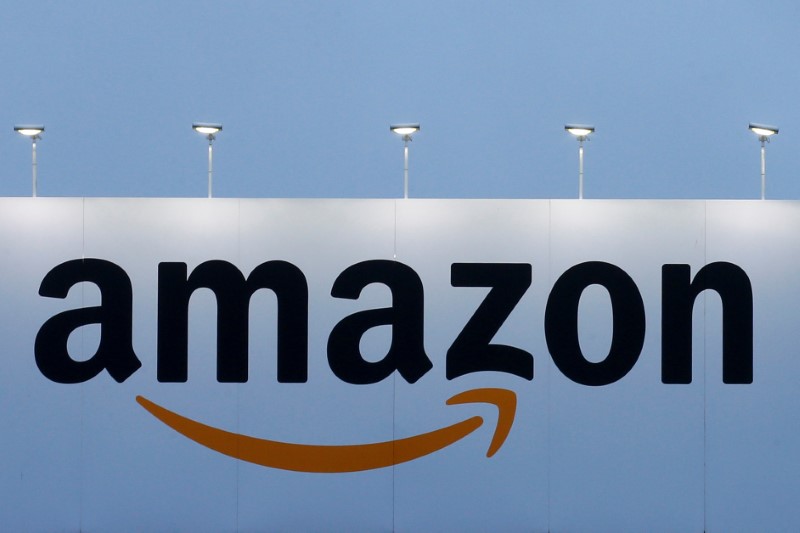 © Reuters. FILE PHOTO - The logo of Amazon is seen at the company logistics center in Lauwin-Planque northern France