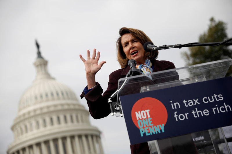 © Reuters. House Minority Leader Nancy Pelosi speaks during a rally against the Republican tax bill on Capitol Hill in Washington