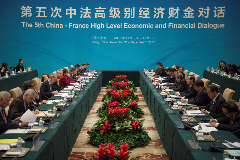 © Reuters. French Economy Minister Bruno Le Maire and Chinese Vice Premier Ma Kai speak during a meeting at the High Level Economic and Financial Dialogue at Diaoyutai State Guesthouse in Beijing, China