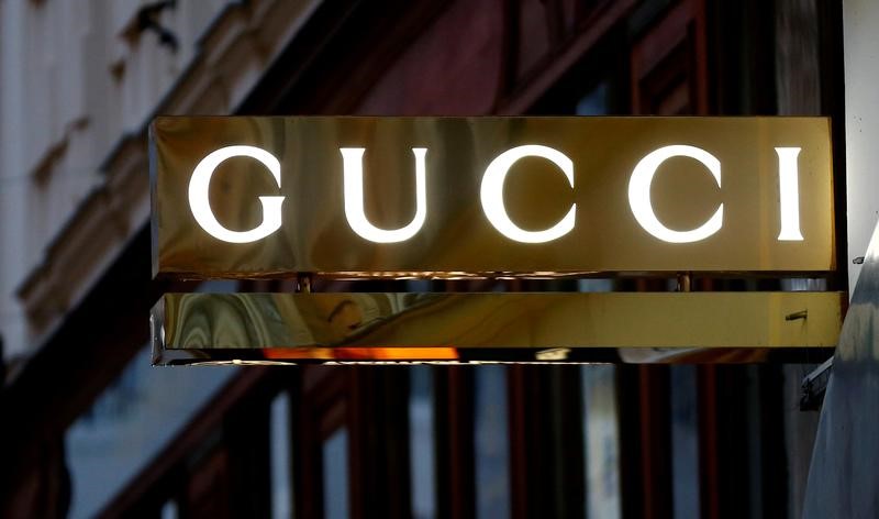 © Reuters. FILE PHOTO: A company logo is pictured outside a Gucci store in Vienna