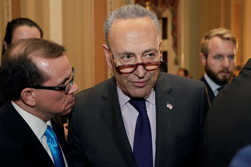 © Reuters. Senate Minority Leader Chuck Schumer (D-NY) leaves following the weekly policy luncheon