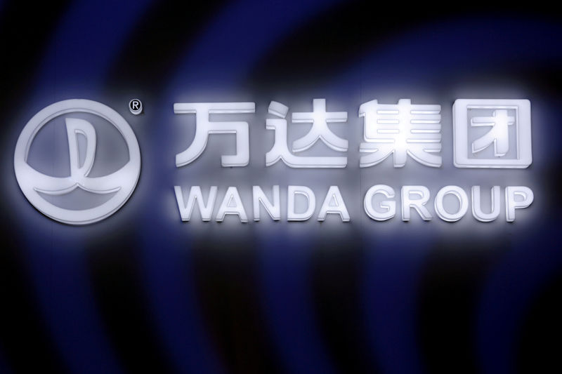 © Reuters. -buFILE PHOTO: A sign of Dalian Wanda Group in China glows during an event in Beijing