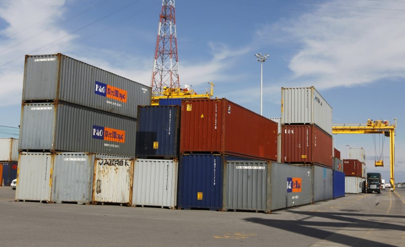 © Reuters. A truck is loaded with a container at the Port of Montreal