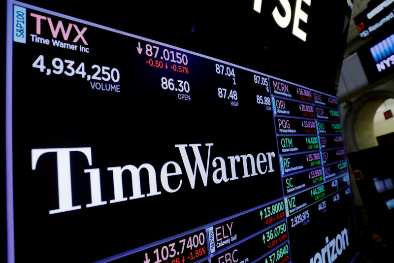 © Reuters. FILE PHOTO: A screen shows the current price of Time Warner shares shortly after the opening bell in New York