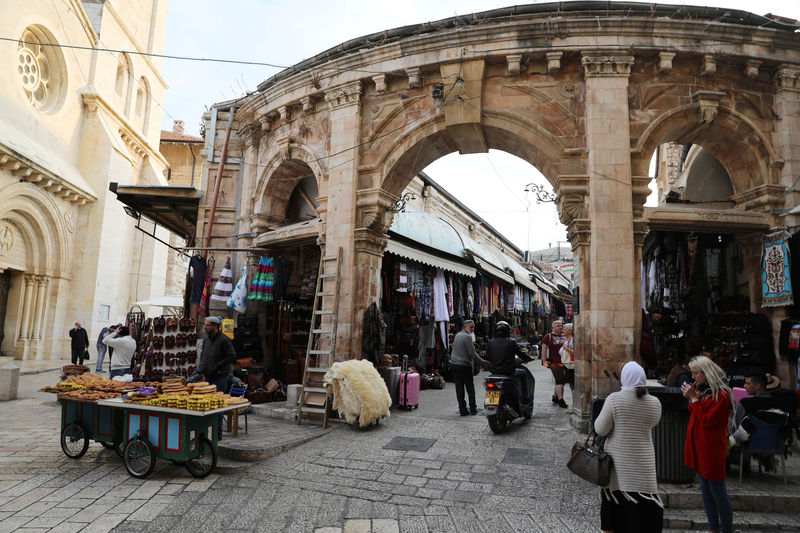 © Reuters. People walk around a street in Jerusalem's Old City