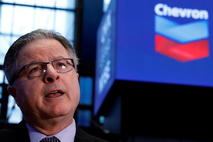 © Reuters. FILE PHOTO - John Watson, Chevron's chairman and CEO, speaks during an interview on the floor of the NYSE in New York