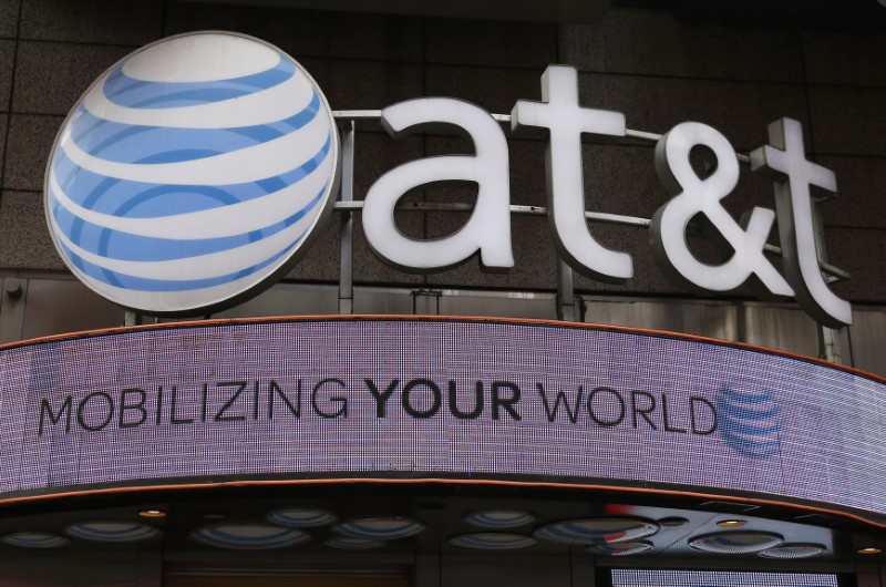 © Reuters. FILE PHOTO - File photo of the signage for an AT&T store is seen in New York